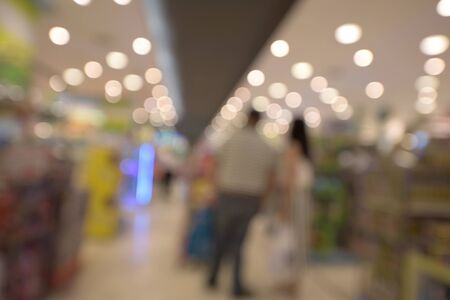 blurred image of people at shopping mallの写真素材