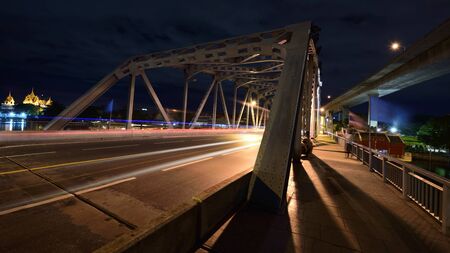 Krungthep Bridge with  montion blurred light at nihgt in Bangkokの写真素材