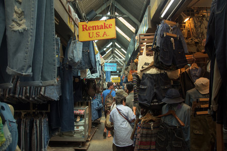 BANGKOK, THAILAND - OCTOBER 24, 2015: Unidentified tourists shopping at Jeans store in Jatujak Market. Here is the largest weekend market open from 8am to 6pm in Bangkok.のeditorial素材