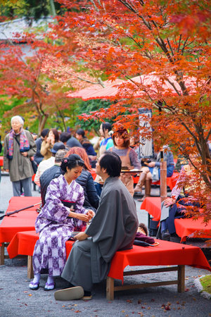 KYOTO, JAPAN - NOVEMBER 13, 2015: Unidentified couple with Traditional Japanese Kimono dress at...