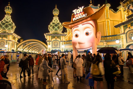 TOKYO, JAPAN- NOVEMBER 08, 2015: Unidentified people at Toy Story Mania area with light decoration at night in Tokyo Disney Sea, opened in 2001 with 176 acres area.のeditorial素材