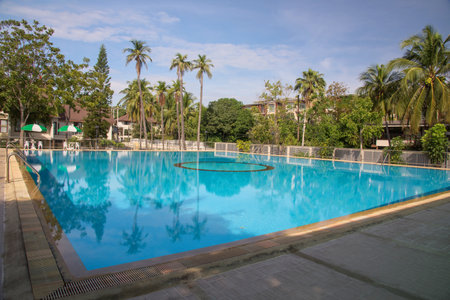 Swimming pool against blue sky at luxury resort, thailandのeditorial素材