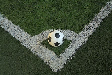 Football at the corner of soccer fieldの写真素材