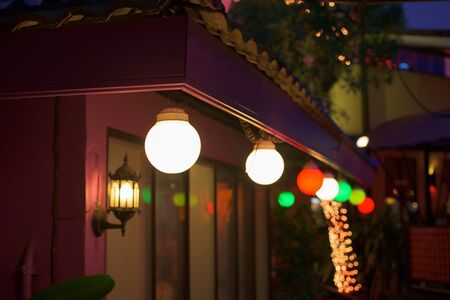 Colorful lamps decorated in front of the buildingの写真素材