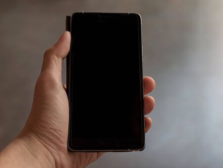 Touch screen smartphone in handの写真素材