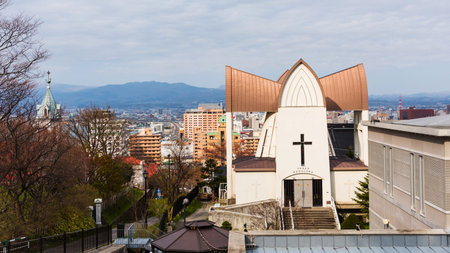 HAKODATE, HOKKAIDO - APRIL 22, 2016: St. John's Church and Motomachi district cityscape. There are many landmarks including Hakodateyama Ropeway, churchs, and Old Hakodate Public hall.のeditorial素材