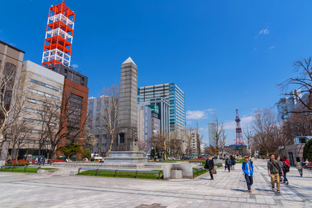 SAPPORO, JAPAN - APRIL 25, 2016: Unidentified people at Odori park, the central park with TV Tower view at Sapporo.のeditorial素材