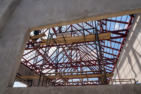 Construction site worker working on scaffolding. Industry concept