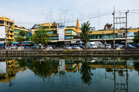 NAKHON PATHOM, THAILAND - MAY 08, 2016: fresh market near the canal and Phra Pathom Chedi.
