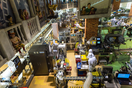 SAPPORO, JAPAN -APRIL 25, 2016: Unidentified staff produce chocolate product inside Chocolate factory "Shiroi Koibito" buildiing by Ishiya, a local chocolate company.のeditorial素材