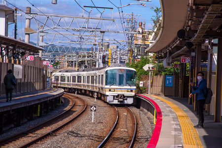 KYOTO, JAPAN - NOVEMBER 11, 2015: Train arrive Tofukuji JR station. Here is very popular station to...