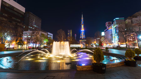 SAPPORO, HOKKAIDO, JAPAN - APRIL 24, 2016: night view of beautiful fountain in Odori park and Sapporo TV tower .のeditorial素材