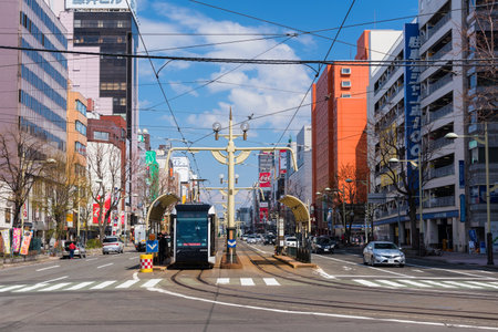 SAPPORO, HOKKAIDO, JAPAN - APRIL 24, 2016: Sapporo modern tram at Shiseikanshogakko-Mae Station, 3 blocks from Susukino station.のeditorial素材