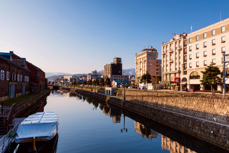 OTARU, JAPAN - APRIL 21, 2016: historic Otaru canal in the morning. The canal with old building and warehouse is the most famous Otaru landmark.のeditorial素材