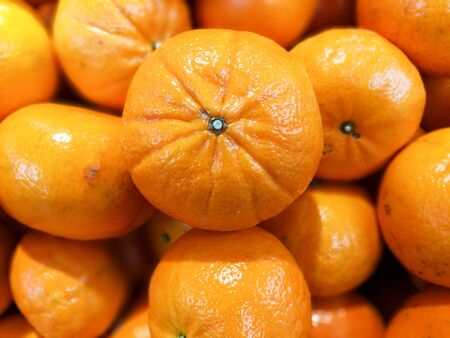 Closeup pile of Fresh mandarin oranges, Healthy lifestyleの写真素材