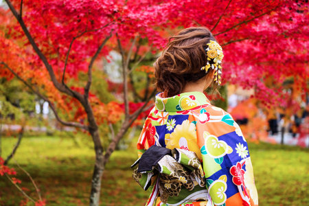 Japanese girl with yellow Kimono enjoy autumn red maple in Nanzen-ji Temple, Kyoto, Japan. The most beautiful season to visit Nanzen-ji temple is autumn.のeditorial素材