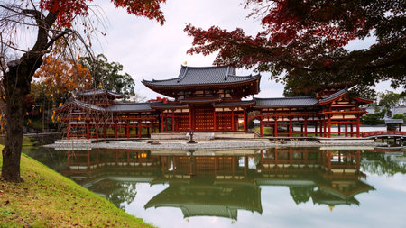 Byodo-in's Phoenix hall with autumn colors in Uji, Kyoto, Japan. Here is the most famous Uji...