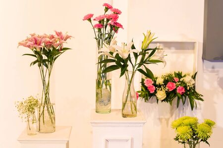 Fresh flower in modern glass pot or bottle for wedding interior decorationの写真素材
