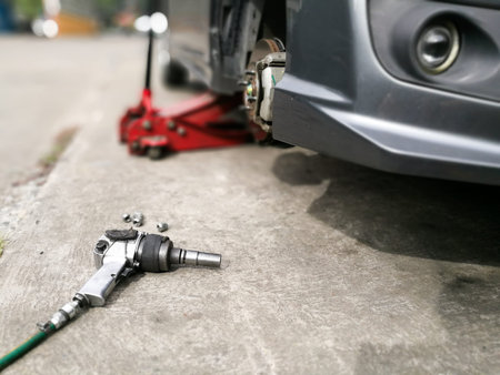 mechanic tools for removing tire to fix disk brake at garageの写真素材