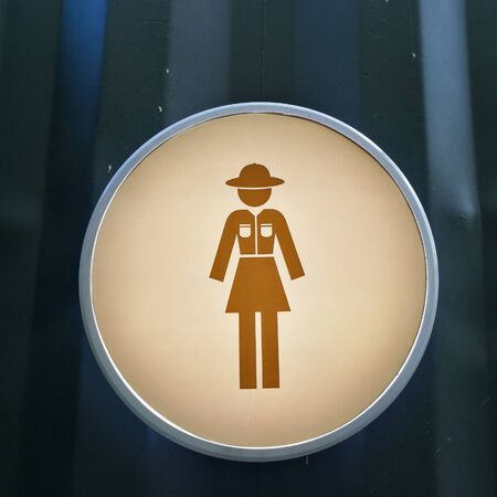 Woman toilet sign on blue zinc metal wallの写真素材