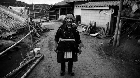 CHIANG RAI, THAILAND - JANUARY 05, 2017: Unidentified Akha smile tribe woman at her village in Mae Salong hill. Black and white processのeditorial素材