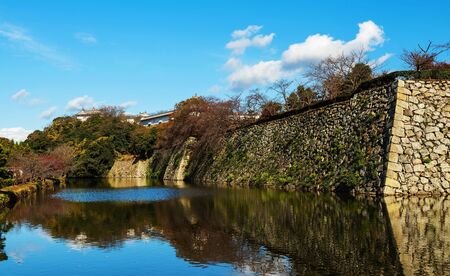 Himeji castle fortress with skyline reflection on the pond, Japanの写真素材