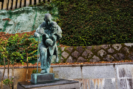 Man carry mom monument at footpath along Minoo or MInoh waterfall, Osaka, Japan