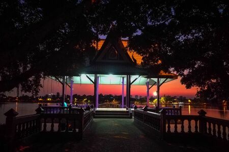 waterfront pavilion at Sri Nakarin's Park with twilight sky at dusk, Nonthaburi, Thailandの写真素材
