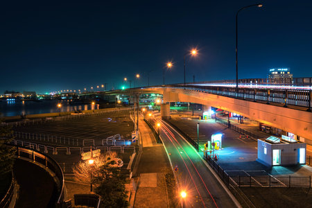 HAKODATE, JAPAN - APRIL 21, 2016: Light trail on the bridge across the seaのeditorial素材