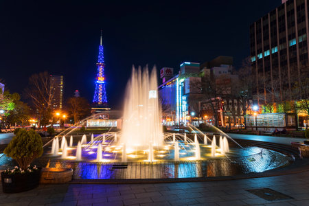 SAPPORO, HOKKAIDO, JAPAN - APRIL 24, 2016: night urban view of beautiful fountain in Odori park and Sapporo TV tower.のeditorial素材