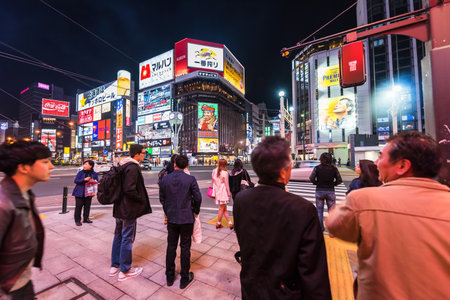 SAPPORO, JAPAN - APRIL 24, 2016: : Uidentified people stand at Susukino intersection. Susukino is a red-light district and  famous night life in Sapporo, Hokkaido.のeditorial素材
