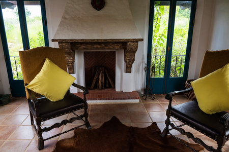 interior of old country house with antique chairs and fireplaceのeditorial素材