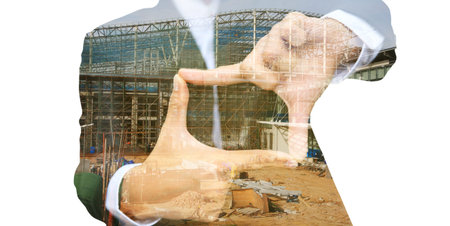 business man thumb and forefinger connect overlay with construction site, Industry concept idea.