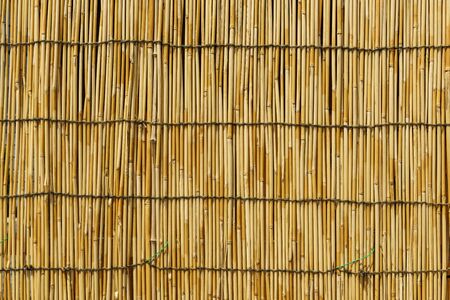 closeup textured bacground of bamboo curtain or wallの写真素材
