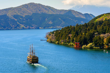 HAKONE, JAPAN - MAY 4, 2017: Top view scene of  pirate tourist ship on Ashi lake to sightseeing red  torii gate  of Hakone shrine and Mt. Fuji. The pirate ship is one of the most famous Hakone signs.のeditorial素材