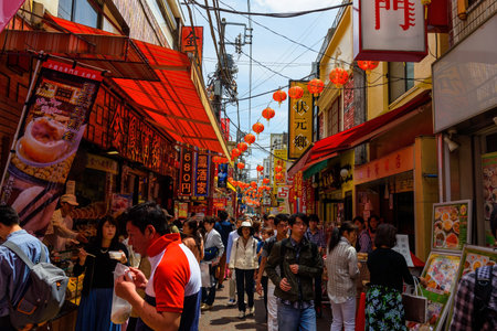 YOKOHAMA, JAPAN - MAY 6, 2017: Unidentified people eating food around Chinese restaurant in Yokohama Chinatown, Here is the largest China town in Japan.のeditorial素材