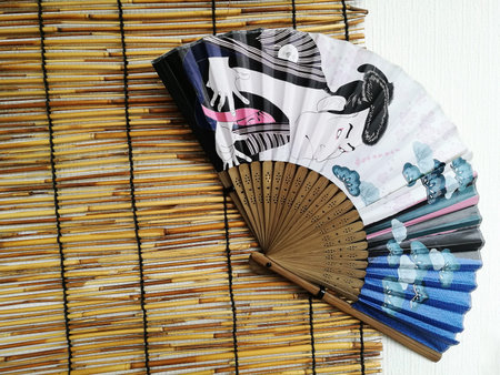 Japanese fan with traditional painting decorated on the tatami wallの写真素材