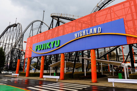 YAMANASHI, JAPAN - MAY 01, 2017: Fuji-Q of Fujikyu Highland amusement park entrance with Roller coaster railway architecture.のeditorial素材