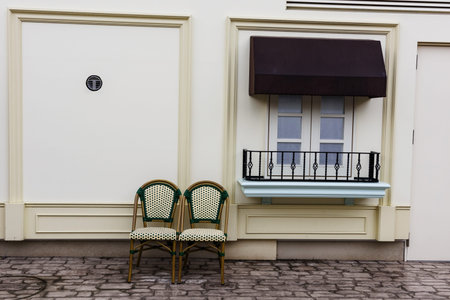 Antique polka dot chairs placed near vintage windowsの写真素材