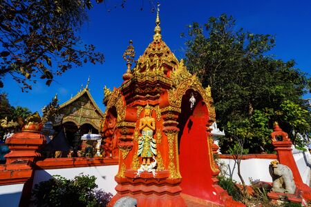 Wat Ming Muang gate entrance against blue sky, Chiang Rai, Thailandの写真素材