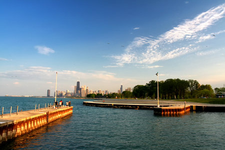 Chicago, IL, USA - May 23, 2007: Unidentified people at Michigan lake near Lake shore drive and Chicago downtown in summer in evening.のeditorial素材