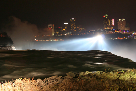 Niagara Falls at night with light up from Canada side. Here is three waterfalls located at international border between Canada and the United Statesの写真素材