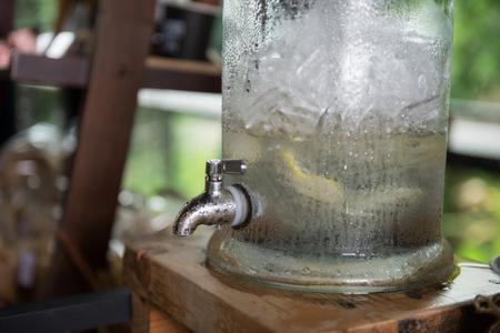 Drinking water with ice in tank at coffee shopの写真素材