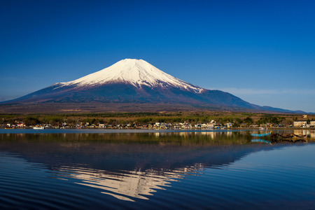 Lake Yamanaka with Mount Fujisan or Fuji, Yamanashi, Japan. Natural scenic landscape with skyline reflection on water. Famous travel destination with copy space for text or background.の写真素材