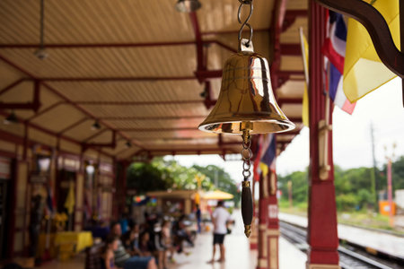 bell with blurred tourist people at Hua Hin train station in Prachuap Khiri Khan Province, Thailand....