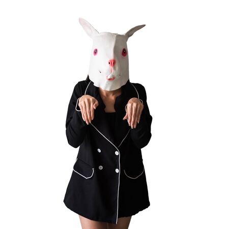 Cute Girl with rabbit mask showing bunny hand sign isolated on white background with copy space for text. Easter and Halloween holiday funny concept. Party Cosplay Animal Latex.の写真素材