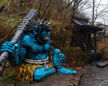Blue demon or giant near wooden shrine in Noboribetsu Hokkaido Japan. Famous monument landmark of The Giants demonstrate Jigokudani Hell valley symbol.のeditorial素材