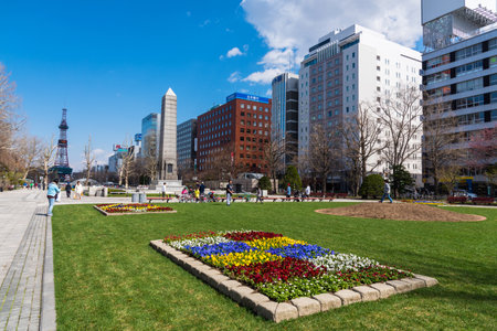 Sapporo, Japan - April 24, 2016 : Unidentified people relax at Odori park, the central park with TV Tower view at Sapporo in sunny day at spring.のeditorial素材