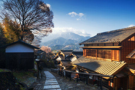 Magome juku old town of Nakasendo with central alps mountain at sunrise, Kiso valley,  Nakatsugawa, Gifu, Japan. Famous travel landmark of preserved Japanese town with Wooden Building Facade.のeditorial素材