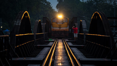 Kanchanaburi, Thailand - October 13, 2019: train on bridge over the river Kwai Khwae in early...